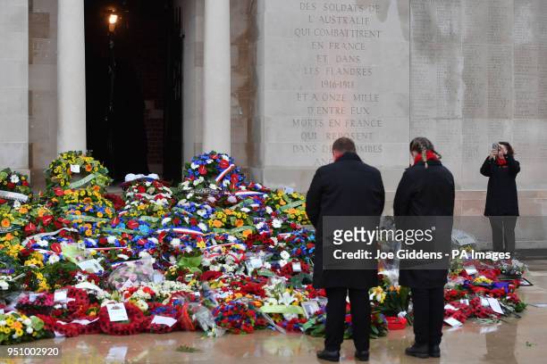 Wreaths laid by descendants of soldiers killed in the First World War during an early morning memorial at the Villers-Bretonneux Memorial in France,...