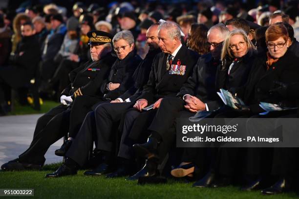 The Prince of Wales sits between French Prime Minister Edouard Philippe and Australian Prime Minister Malcolm Turnbull during an early morning...