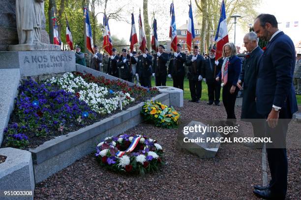 French Prime Minister Edouard Philippe and Australian Prime Minister Malcolm Turnbull pay their respects at the war memorial in Villers-Bretonneux,...