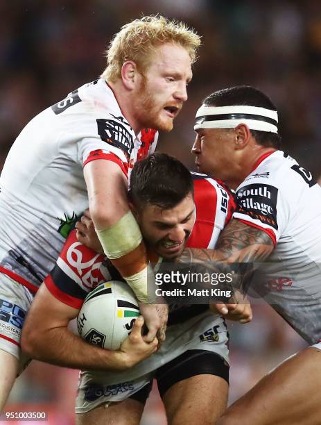James Tedesco of the Roosters is tackled during the round eight NRL match between the St George Illawara Dragons and Sydney Roosters at Allianz...