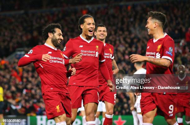 Mohamed Salah and Virgil van Dijk of Liverpool celebrate with goalscorer Roberto Firmino after scoring the fifth goal during the UEFA Champions...
