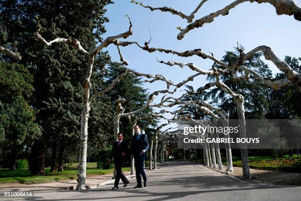 Spanish Prime Minister Mariano Rajoy takes a walk with Mexican President Enrique Pena Nieto during a meeting at La Moncloa in Madrid on April 25,...