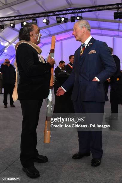 The Prince of Wales meets indigenous didgeridoo player David Dahwurr Hudson after an early morning memorial at the Villers-Bretonneux Memorial in...