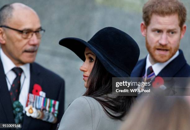 Britain's Prince Harry and his US fiancee Meghan Markle talk with New Zealand's High Commissioner to the United Kingdom, Jerry Mateparae, during an...