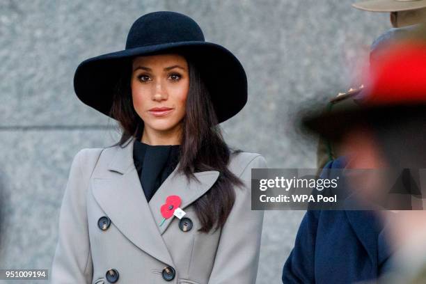 Meghan Markle, the US fiancee of Britain's Prince Harry, attends an Anzac Day dawn service at Hyde Park Corner on April 25, 2018 in London, England....