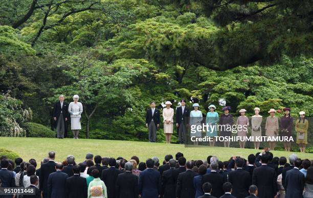 Japan's Emperor Akihito and Empress Michiko stand on a hill with members of the royal family, Crown Prince Naruhito, Crown Princess Masako, Prince...