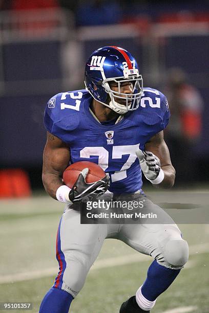 Running back Brandon Jacobs of the New York Giants carries the ball during a game against the Philadelphia Eagles on December 13, 2009 at Giants...
