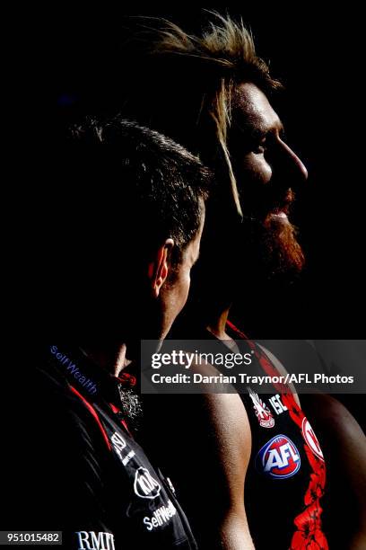 John Worsfold, Senior Coach of the Bombers and captasin Dyson Heppell line up for the playing of the 'Last Post' before the round five AFL match...