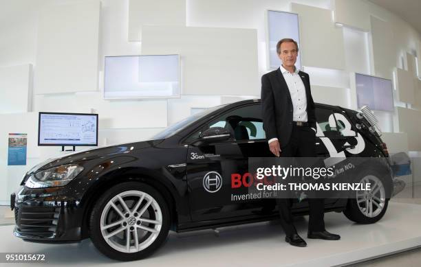 Volkmar Denner, CEO of German electronic and engineering company Bosch, poses next to a diesel powered testcar prior to the company's annual press...