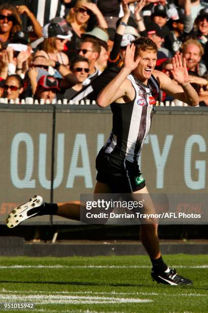 Will Hoskin-Elliott of the Magpies celebrates a goal during the round five AFL match between the Collingwood Magpies and the Essendon Bombvers at...