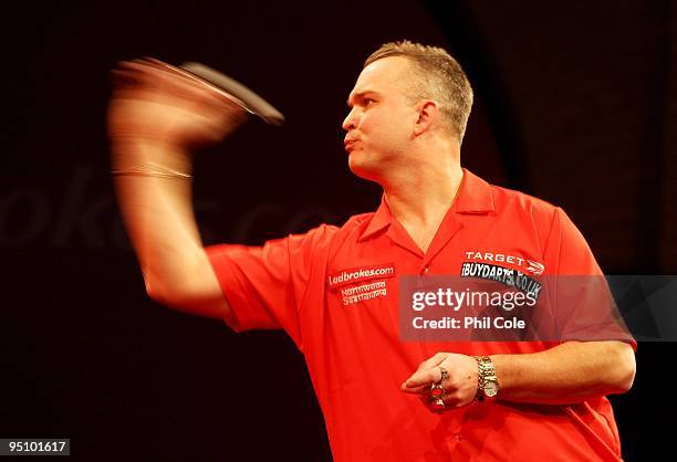 Alex Roy of England in action against Wayne Jones of England during the 2010 Ladbrokes.com World Darts Championship Round One at Alexandra Palace on...