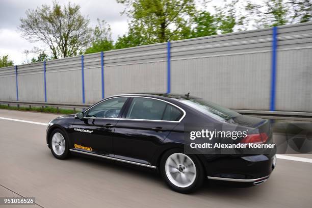 Converted Volkswagen Passat car drives as artificial intelligence takes over driving the car during tests of autonomous car abilities conducted by...
