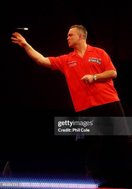 Alex Roy of England in action against Wayne Jones of England during the 2010 Ladbrokes.com World Darts Championship Round One at Alexandra Palace on...