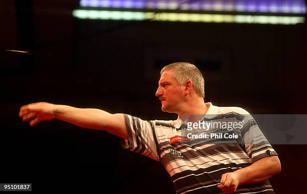 Wayne Jones of England in action against Alex Roy of England during the 2010 Ladbrokes.com World Darts Championship Round One at Alexandra Palace on...