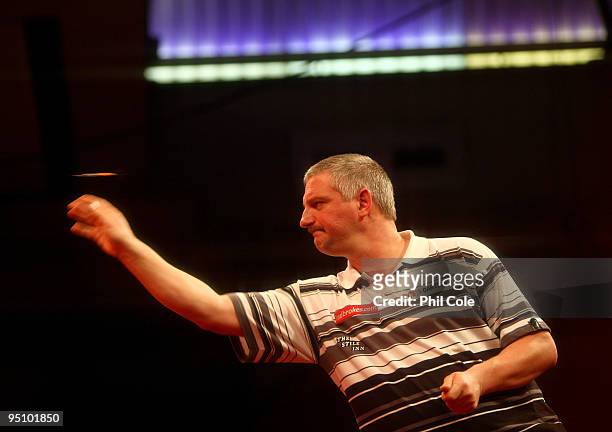 Wayne Jones of England in action against Alex Roy of England during the 2010 Ladbrokes.com World Darts Championship Round One at Alexandra Palace on...