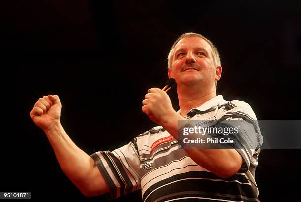 Wayne Jones of England celabrates winning against Alex Roy of England during the 2010 Ladbrokes.com World Darts Championship Round One at Alexandra...