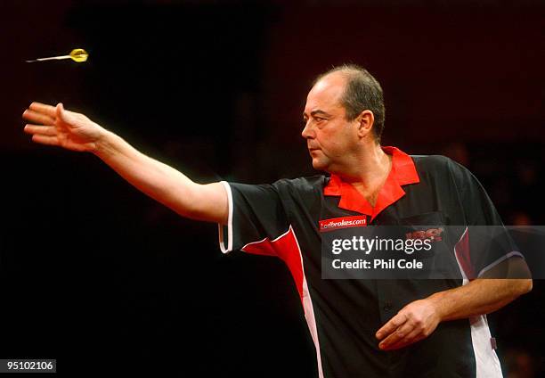 Fransisco Ruiz of Spain in action against Magnus Caris of Sweden during the 2010 Ladbrokes.com World Darts Championship Round One at Alexandra Palace...