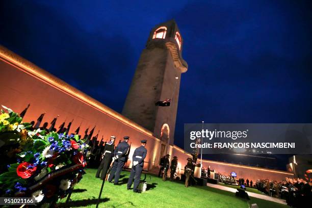 Photo taken on April 25, 2018 shows people attending ceremonies marking the 100th anniversary of ANZAC Day at the Australian cemetery in...