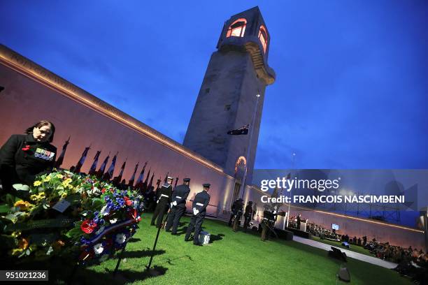 Photo taken on April 25, 2018 shows people attending ceremonies marking the 100th anniversary of ANZAC Day at the Australian cemetery in...