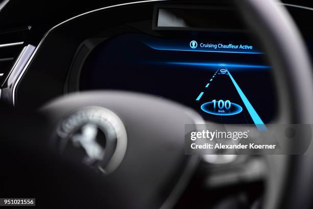 Close up of the digital display while a camera and radar system assists as artificial intelligence takes over driving the car during tests of...