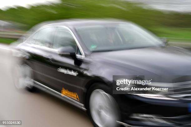 Converted Volkswagen Passat car drives as artificial intelligence takes over driving the car during tests of autonomous car abilities conducted by...