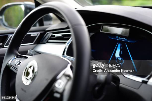 Close up of the digital display while a camera and radar system assists as artificial intelligence takes over driving the car during tests of...