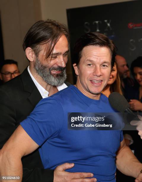 Director/actor Baltasar Kormakur surprises actor Mark Wahlberg during an interview at CinemaCon 2018 STXfilms Invites You to an Evening Featuring A...