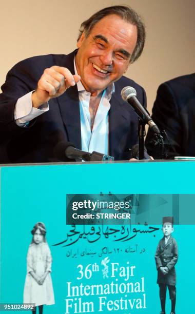 Film director Oliver Stone speaks at a press conference during the Fajr Film festival in the Iranian capital Tehran on April 25, 2018. - The...