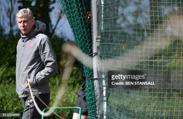 Arsenal's French manager Arsene Wenger attends a training session on the eve of their Europa League first leg semi-final football match against...