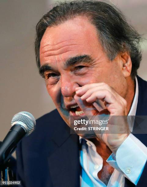 Film director Oliver Stone speaks at a press conference during the Fajr Film festival in the Iranian capital Tehran on April 25, 2018. - The...