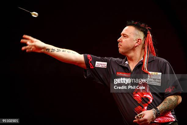 Peter Wright of England in action against Michael van Gerwen of the Netherlands during the 2010 Ladbrokes.com World Darts Championship Round One at...