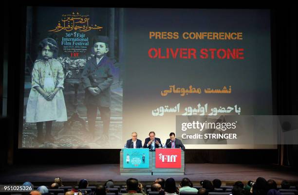 Film director Oliver Stone speaks at a press conference during the Fajr Film festival in the Iranian capital Tehran on April 25, 2018. - The...