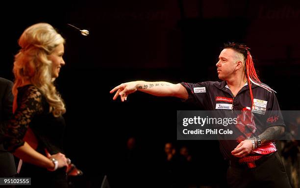 Peter Wright of England in action against Michael van Gerwen of the Netherlands during the 2010 Ladbrokes.com World Darts Championship Round One at...