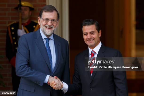 Spanish President Mariano Rajoy shake hands with President of Mexico Enrique Pena Nieto as they pose for the press during Nieto's arrival at Moncloa...