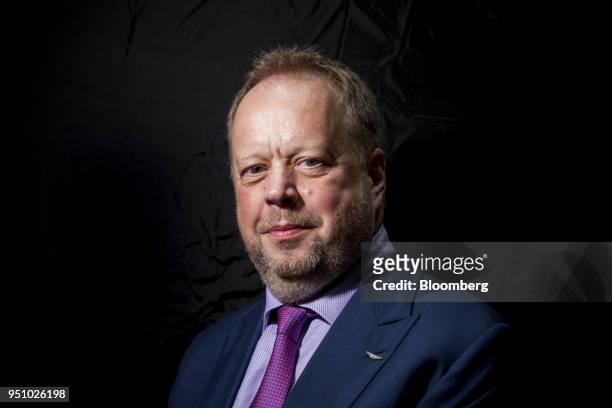 Andy Palmer, chief executive officer of Aston Martin Lagonda Ltd., poses for a photograph following a Bloomberg Television interview at the Beijing...