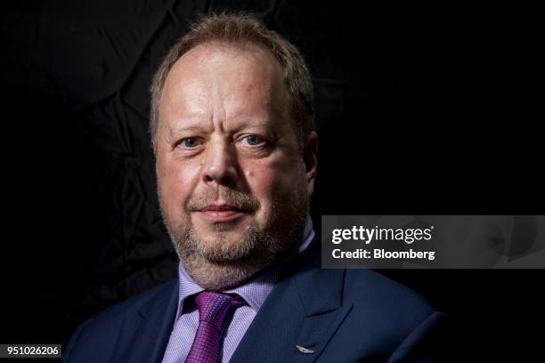 Andy Palmer, chief executive officer of Aston Martin Lagonda Ltd., poses for a photograph following a Bloomberg Television interview at the Beijing...