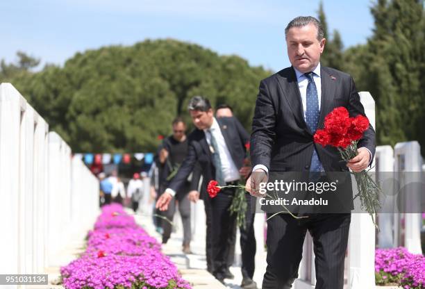 Turkish Youth and Sports Minister Osman Askin Bak lays red cloves at the symbolic cemetery during the closure ceremony of 'March to the 57th Infantry...