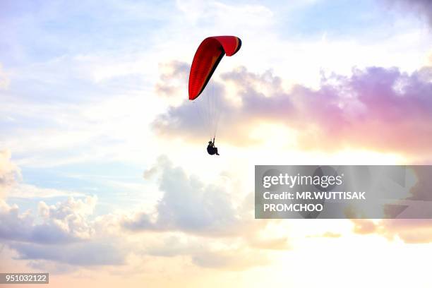 paramotor flying in the sky. - motor paraglider stock pictures, royalty-free photos & images