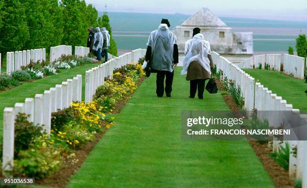 Photo taken on April 25, 2018 shows people visiting the Australia - New Zealand military cemetery in Villers-Bretonneux, northern France, during...