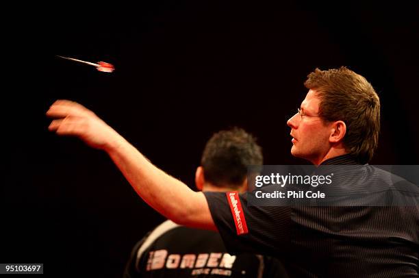 James Wade of England in action against Steve Brown of England during the 2010 Ladbrokes.com World Darts Championship Round One at Alexandra Palace...