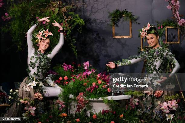 Dancers Alison Parsons and Georgia Paton-Durrant pose in a floral display called Greenhouse during staging day for the Harrogate Spring Flower Show...