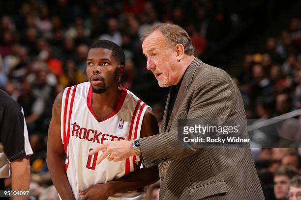 Aaron Brooks and head coach Rick Adelman of the Houston Rockets talk strategy during the game against the Golden State Warriors on December 3, 2009...