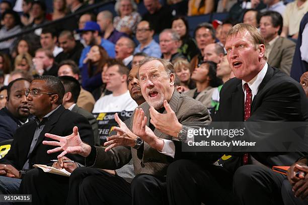 Assistant coach Jack Sikma and head coach Rick Adelman of the Houston Rockets react on the sideline during the game against the Golden State Warriors...