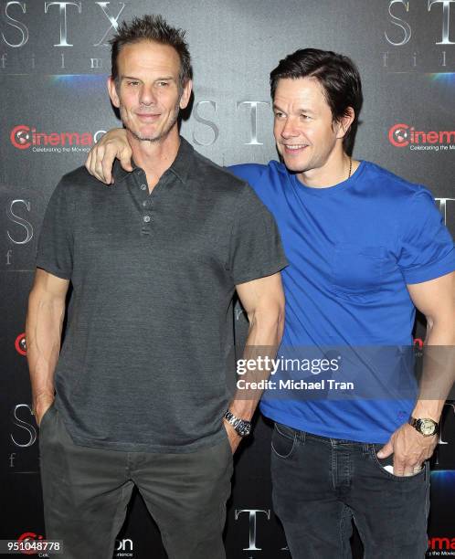 Mark Wahlberg and Peter Berg attend the 2018 CinemaCon - An Evening With STXfilms featuring a sneak preview of their future films held at The...