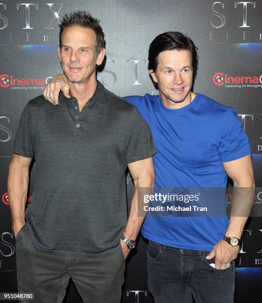 Mark Wahlberg and Peter Berg attend the 2018 CinemaCon - An Evening With STXfilms featuring a sneak preview of their future films held at The...