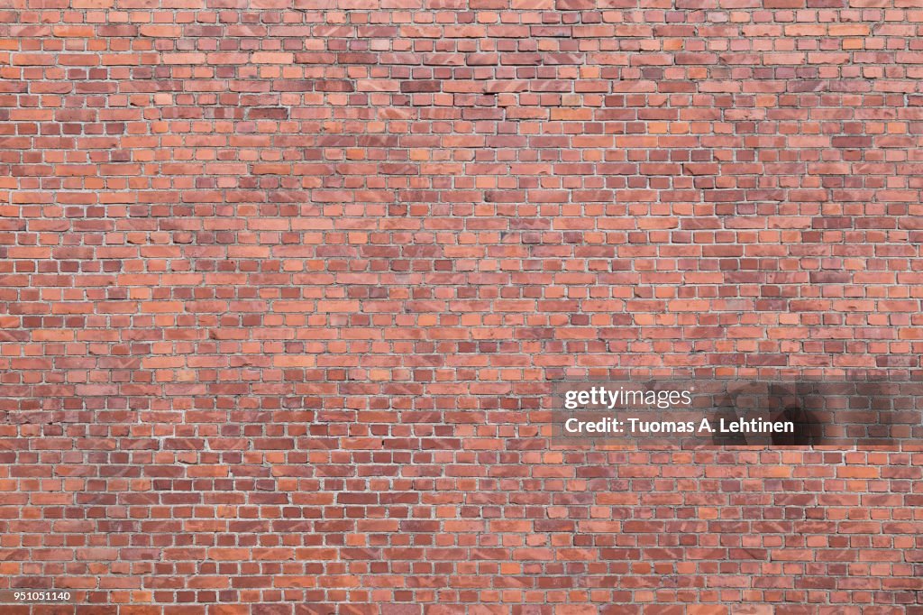 Big full frame background of detailed old red brick wall with copy space