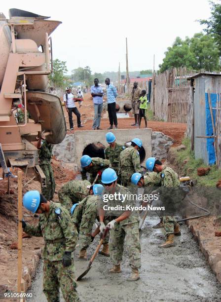 File photo taken in March 2013 shows Japan Self-Defense Forces personnel engaging in construction work in Juba, the capital of South Sudan, as part...