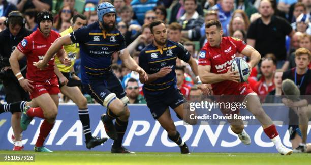 Gareth Davies of the Scarlets breaks with the ball during the European Rugby Champions Cup Semi-Final match between Leinster Rugby and Scarlets at...