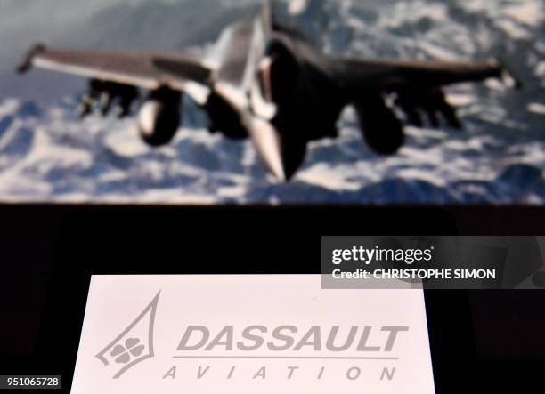 An illustration photo taken on April 25, 2018 in Paris shows the logo of international French aircraft manufacturer Dassault Aviation in front of a...