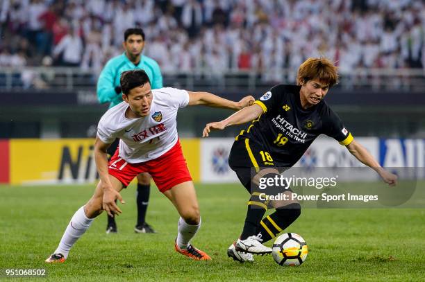 Tianjin Defender Kwon Kyung-Won in action against Kashiwa Reysol Forward Yusuke Segawa during the AFC Champions League 2018 Group E match between...